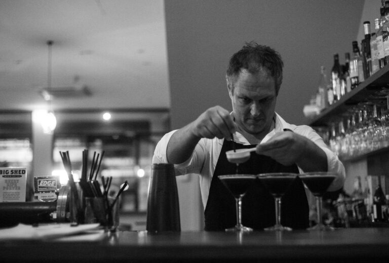 Bartender preparing espresso martinis at a stylish Richmond function venue.