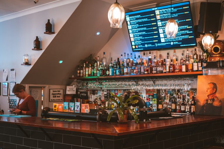 Back bar stocked with spirits and wine at a function venue in Richmond