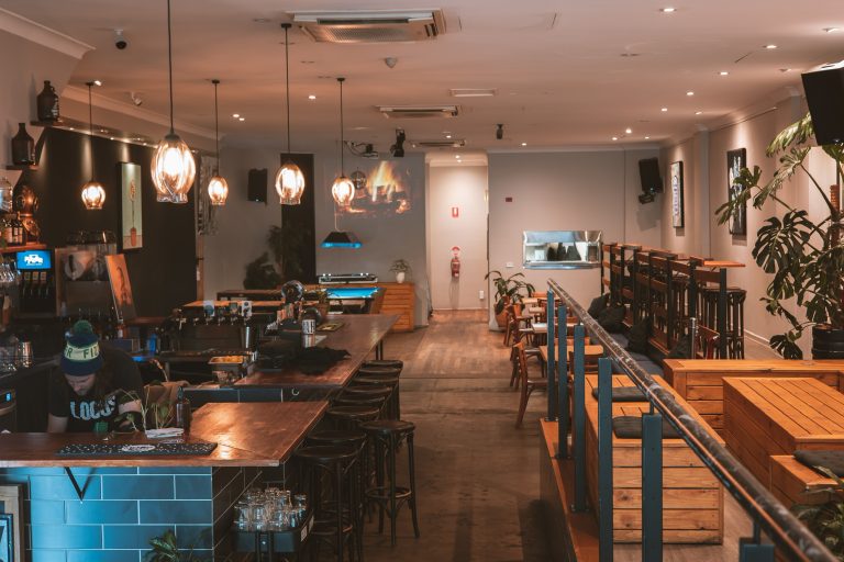 Inviting bar area with seating and warm lighting inside a function venue in Richmond.