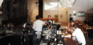 The interior of Concrete Boots Bar Richmond, showing locals enjoying craft beer and cocktails in a modern industrial function space.