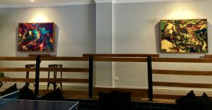 Art gallery wall with two abstract paintings at a function venue in Richmond